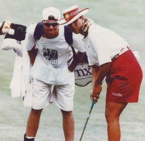 Michelle playing in golf tournament